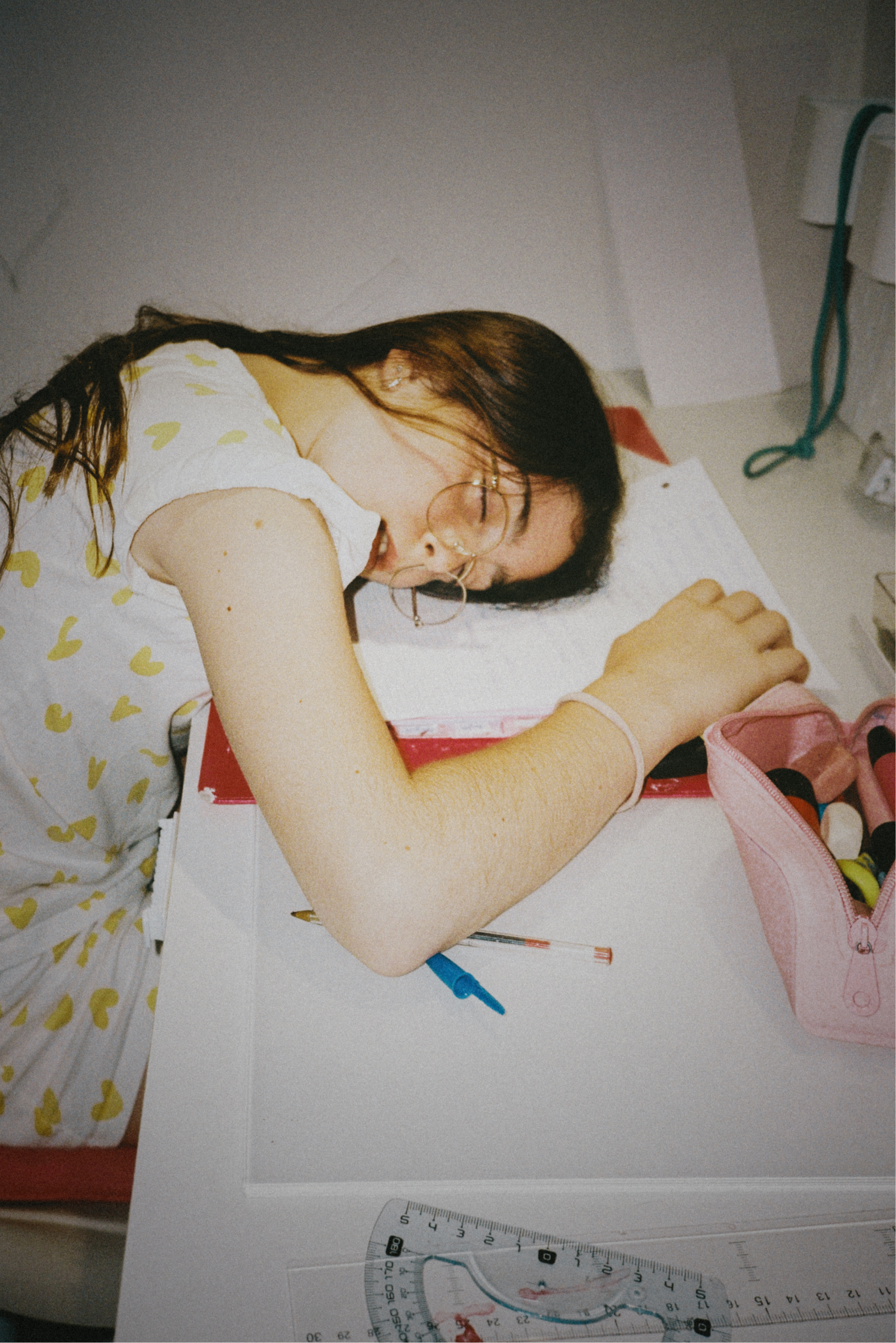 Emblem design for Madame FC depicting an M monogram in a circle with the words "Madame FC EST. 2003" inside on top of a background image of a soccer stadium.